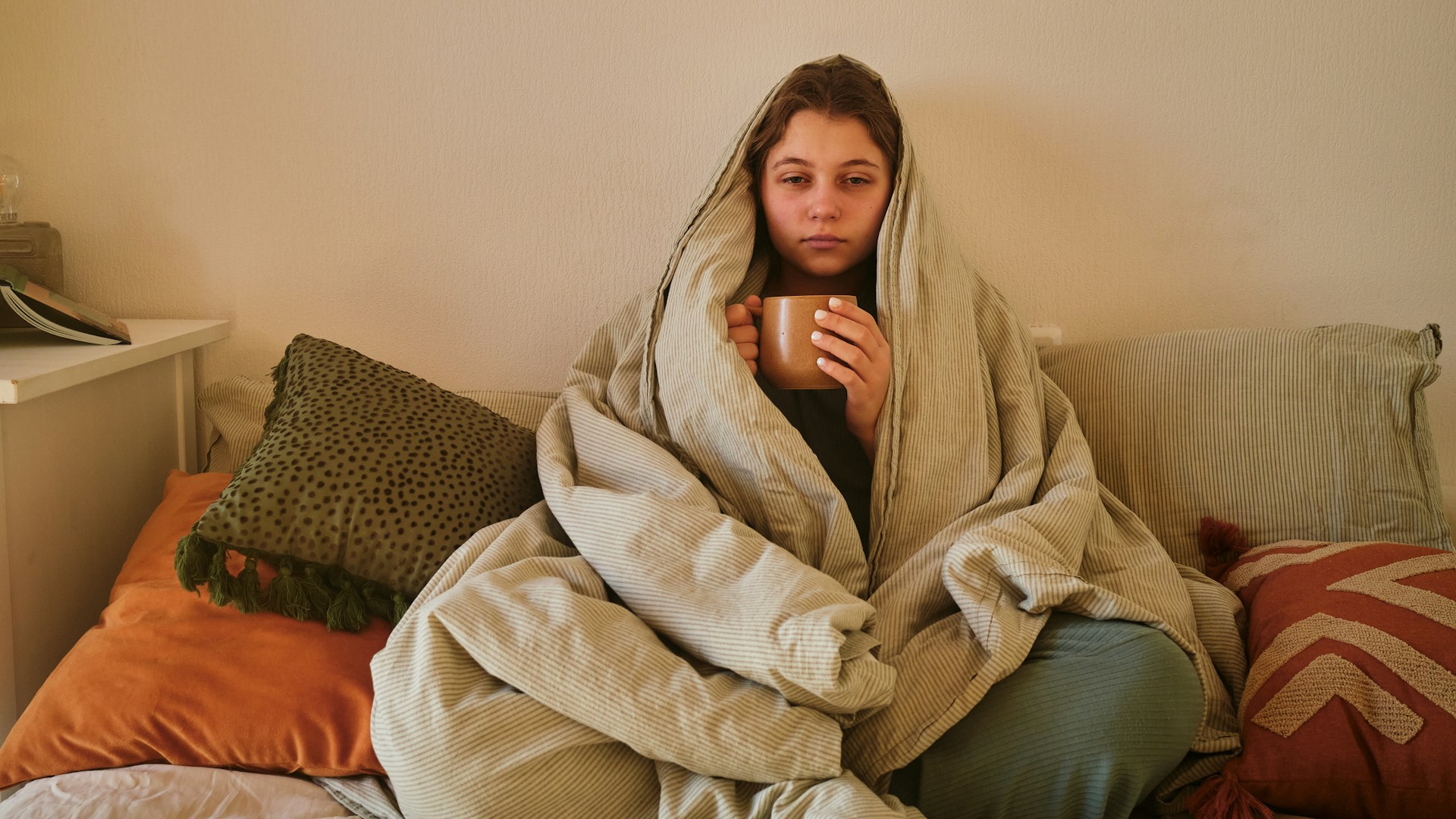 woman with broken heating at home